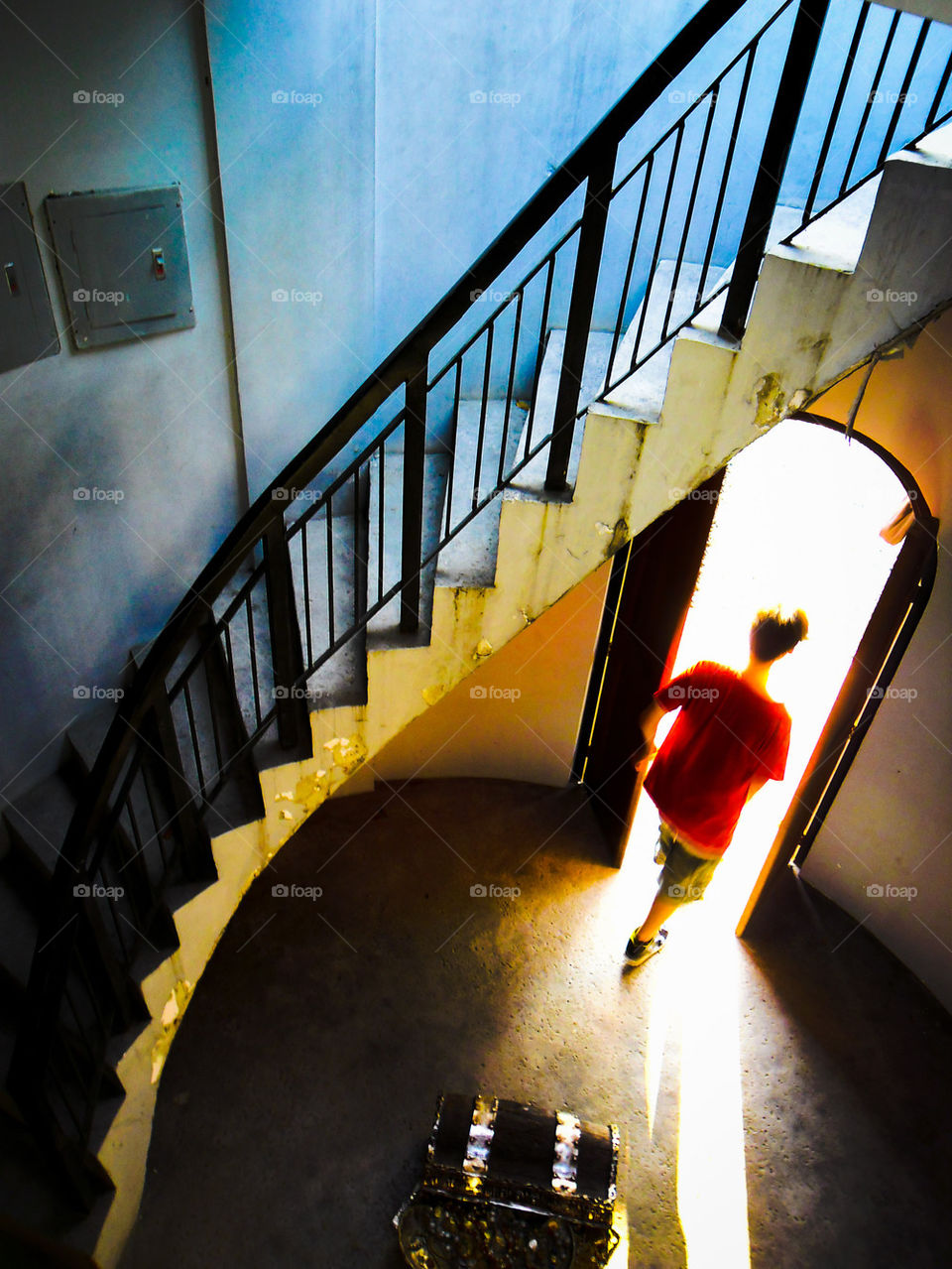 stairs and man walking out a door