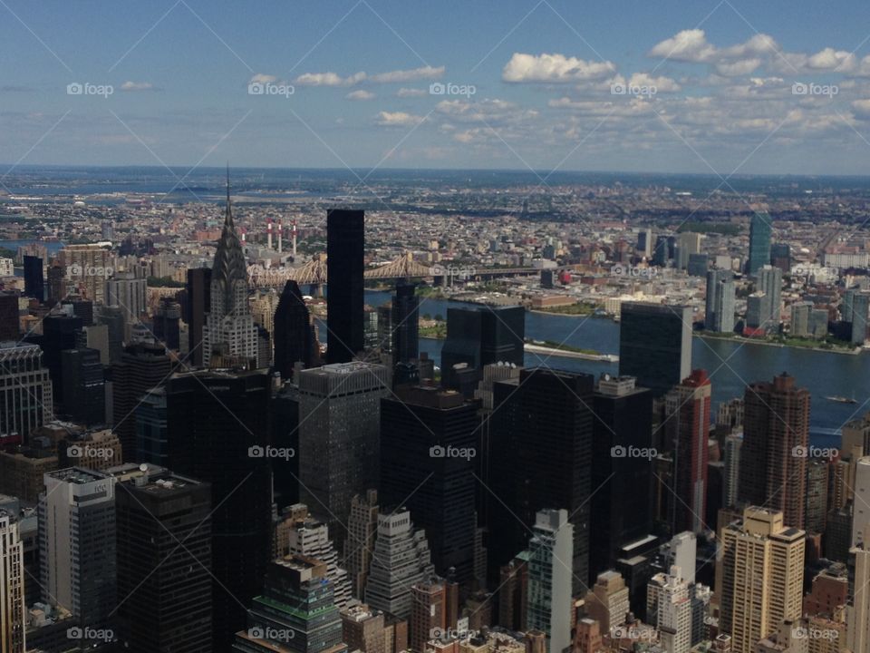 NYC. View from the Empire State Building. Skyline. New York City  views. City-scape  miles and miles... River and bridge, harbor along the city. shadows on the city 