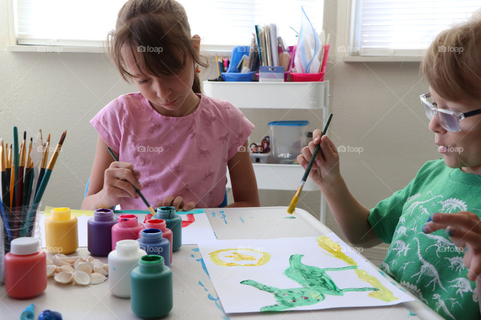 Children creating paintings