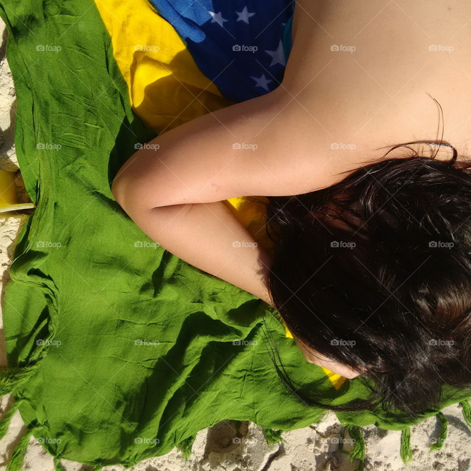 Girl getting Tan. guaruja beach
