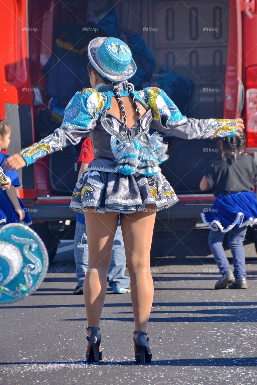 Peruvian girl dancing in the street