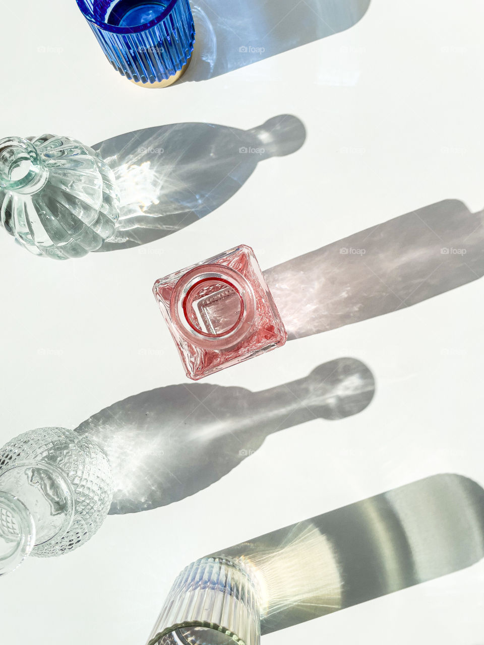 Glass sparkles in the sun with long shadows 