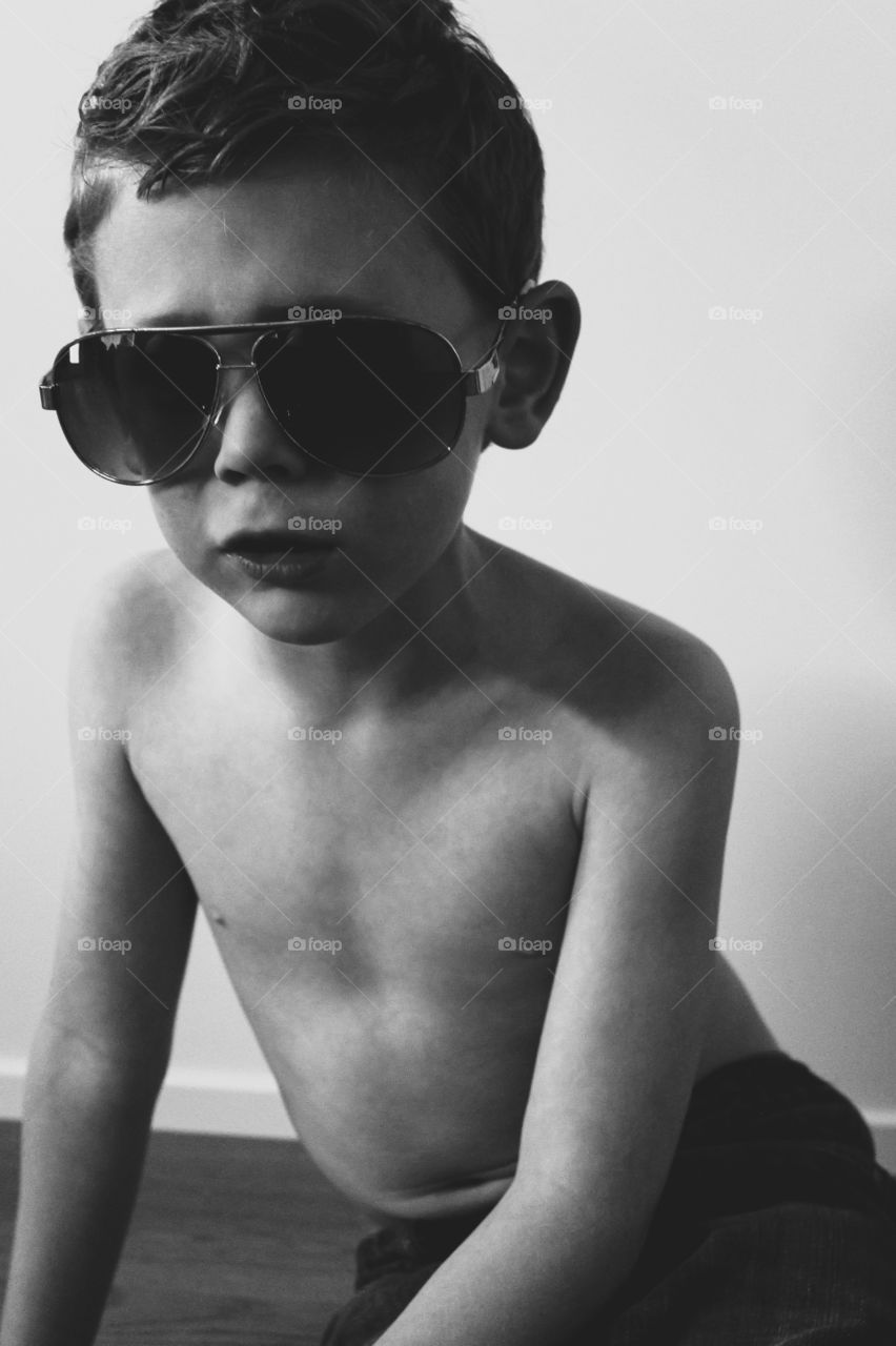 Playing dress up with mommy’s sunglasses 