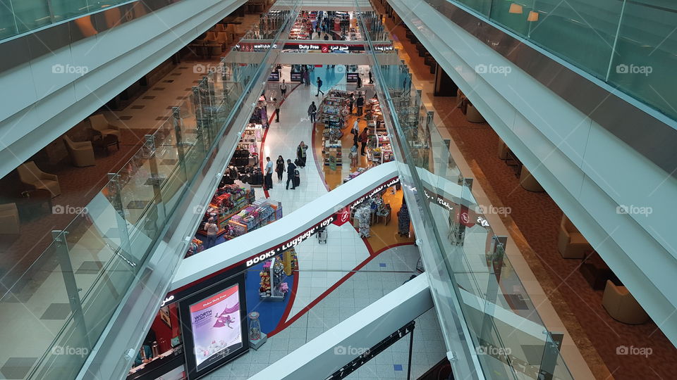 Passengers browse in the shops in Dubai International Airport, in the UAE