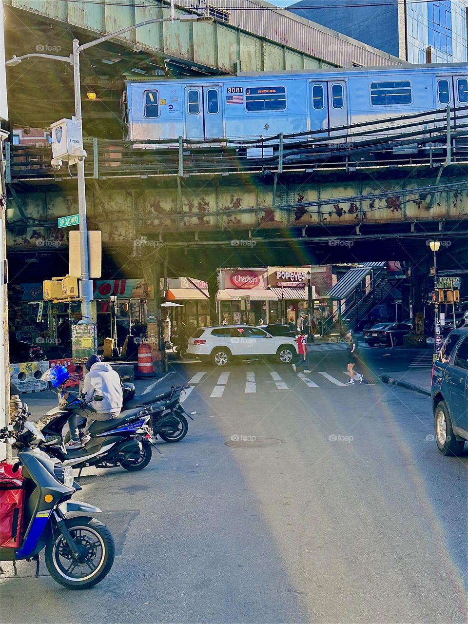 This overpass is the “M” train station on “Myrtle Avenue” and “Broadway” in “Bushwick”, Brooklyn. Just like I do every month I have traveled here once again via the “B43” bus to visit “MG Pharmacy”. 2024. Hypnotic Productions
