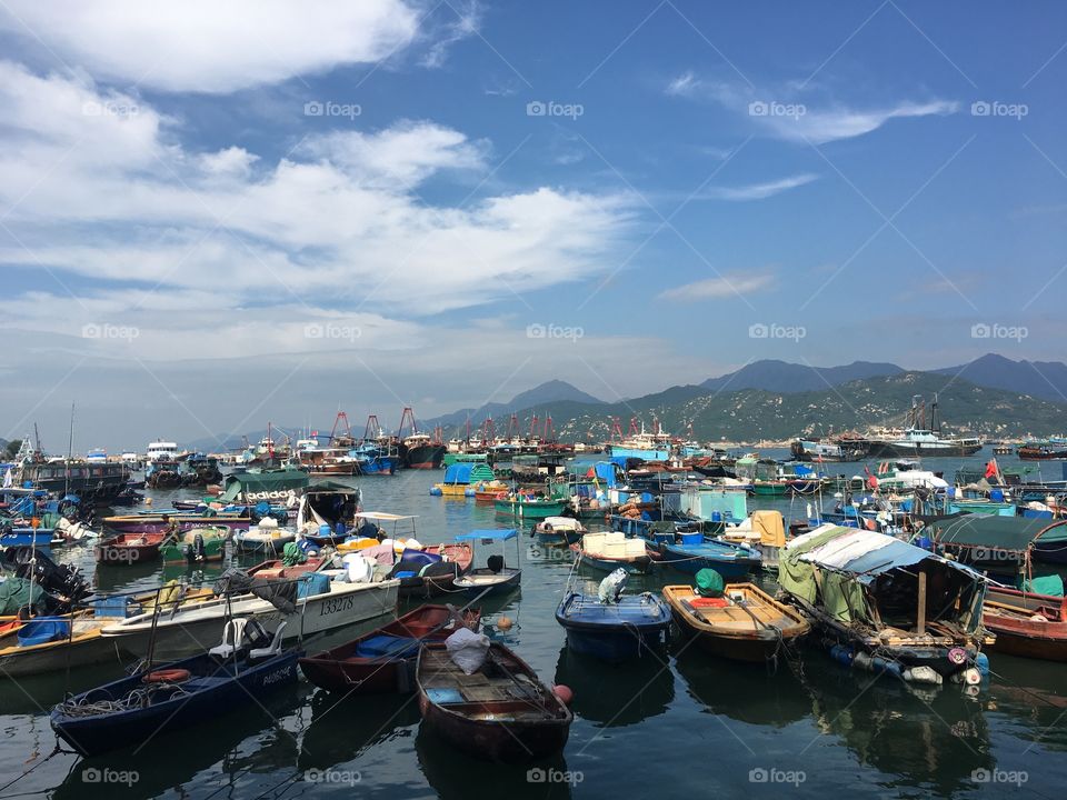 Cheung Chau is a tiny fishing community in Hong Kong. Many villagers still live on their boats. Their sea legs are bowed when they walk on land 
