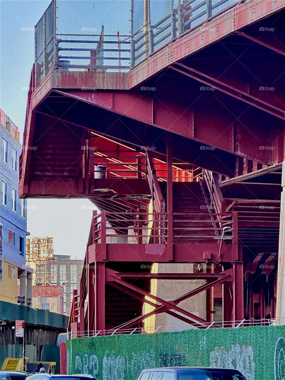 This is the “Bauhaus” inspired “Pulaski Bridge” at “Newtown Creek” in “Greenpoint”, Bklyn. The red color, a building style based on simple geometric shapes and form merging with function are all tenets of the “Bauhaus”. 2024. Hypnotic Productions