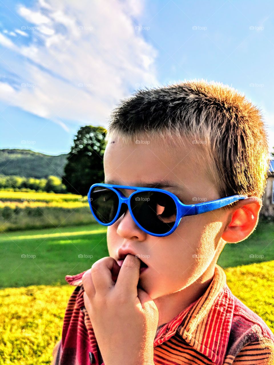 Blue sunglasses on handsome boy