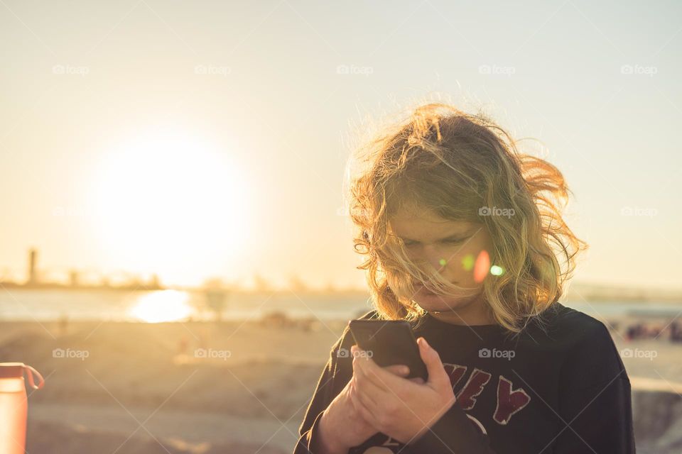 girl looking in her smartphone