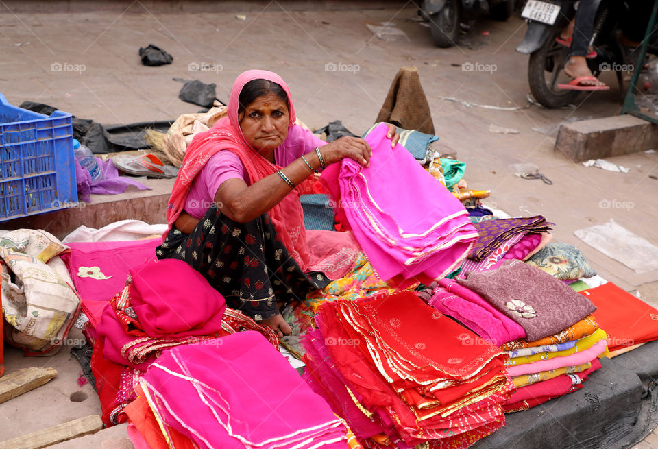 Old lady selling clothes in Jodhpur, Rajasthan, India