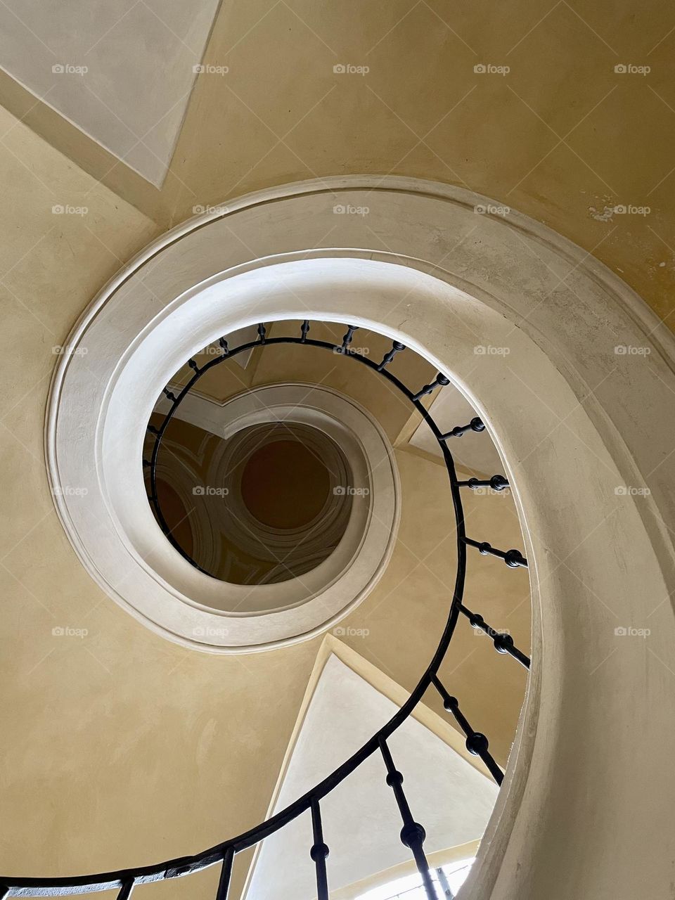 Photo of spiral stairs in the church in Kutná Hora. The stairs go in a spiral.