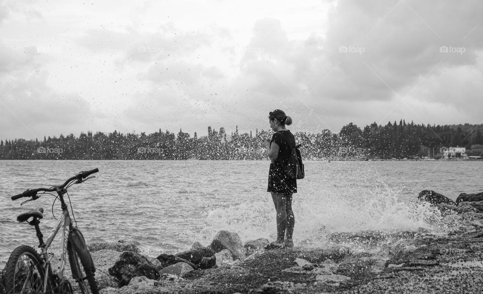 Girl standing next to the sea
