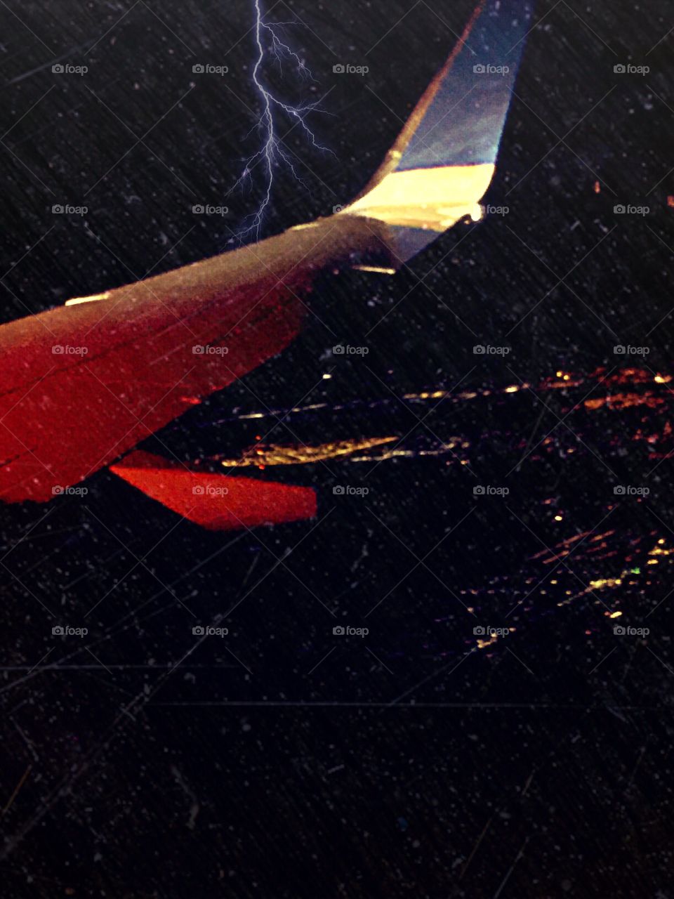 Lightning strike and rain from an aerial view.