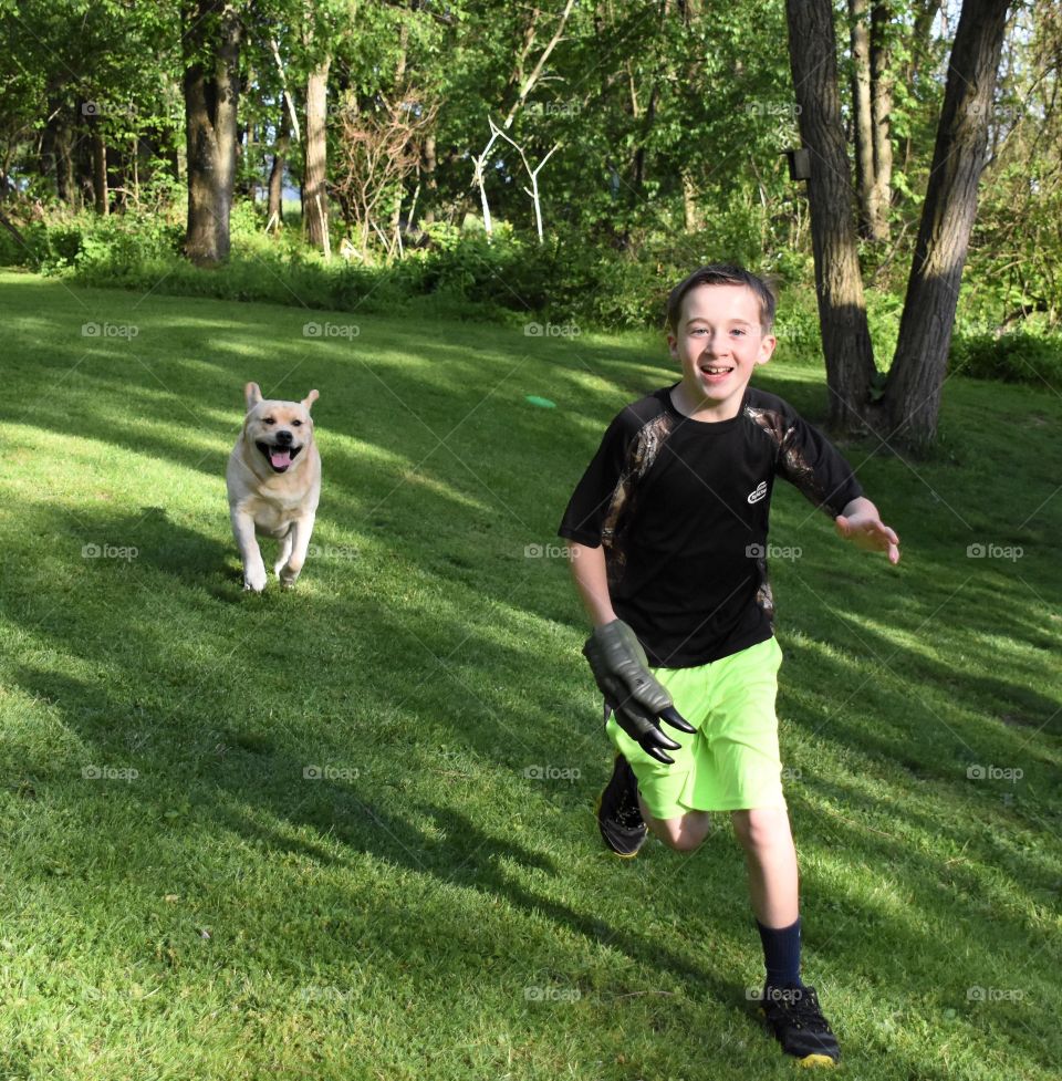 A spring walk with your dog, a young boy and his yellow lab