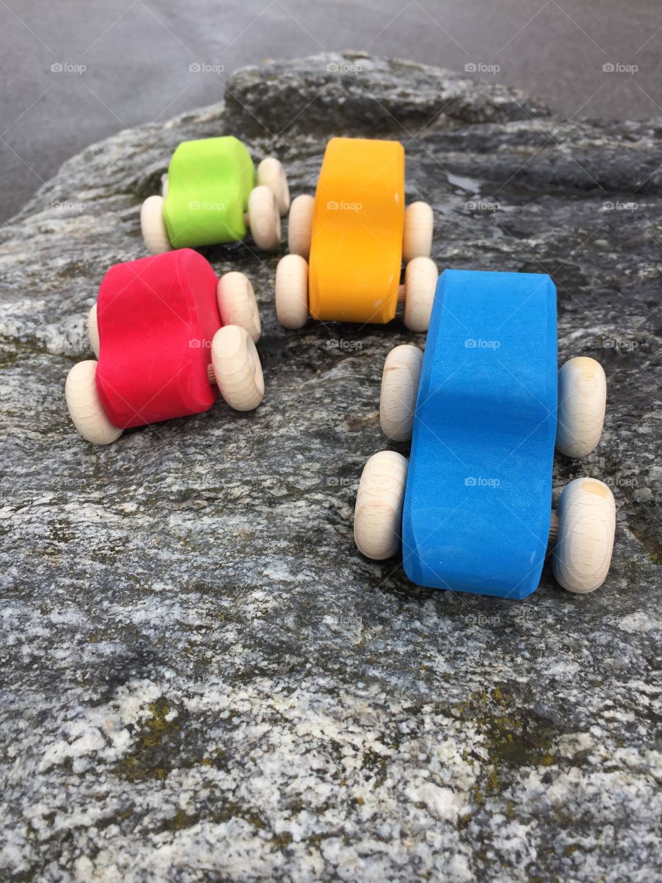 Wooden cars on rock