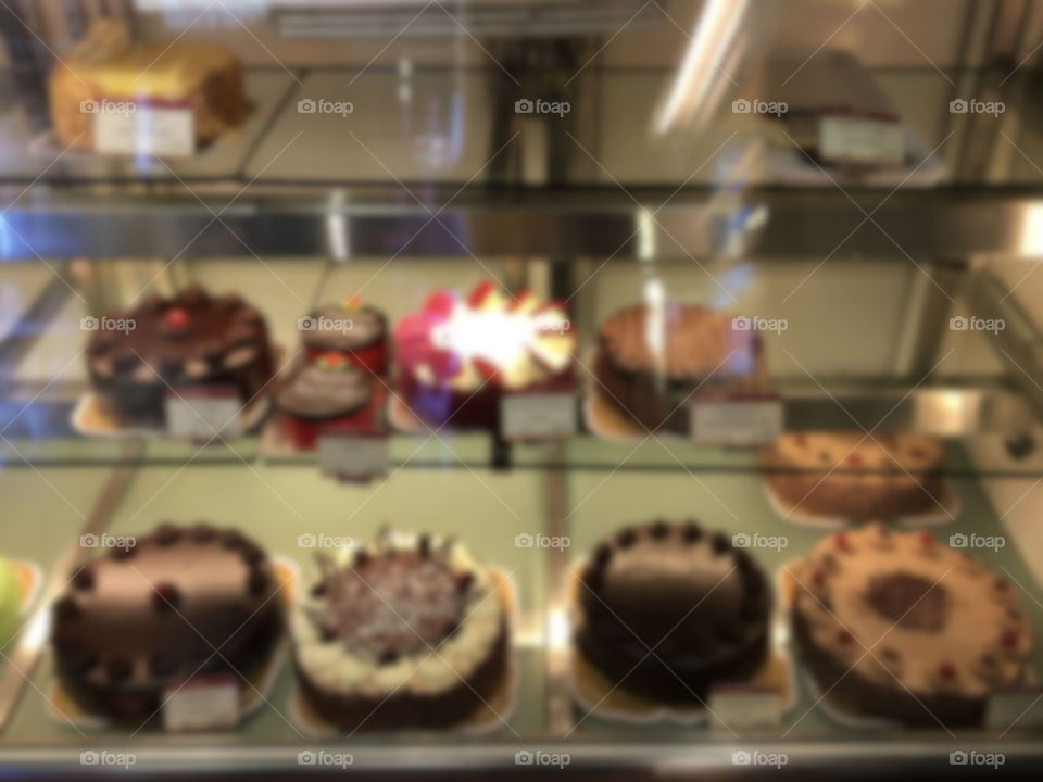 Blur image of several cakes.