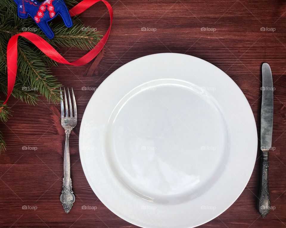 white empty plate with cutlery, a festive table setting