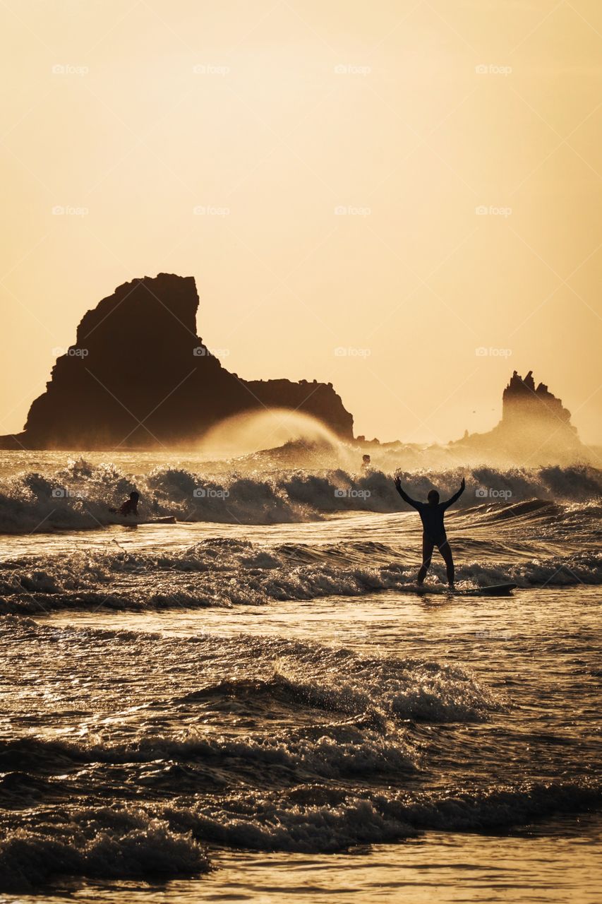 The excitement of a beginner surfer when she managed to stand up on the board