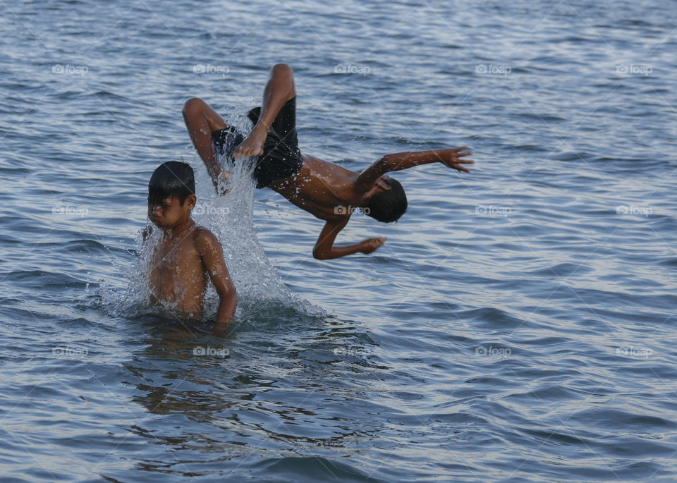 Children swimming and playing on the water