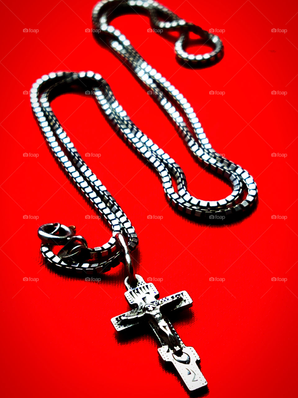 Orthodox silver cross with a silver chain Ф in the form of the letter: "N" on a red background