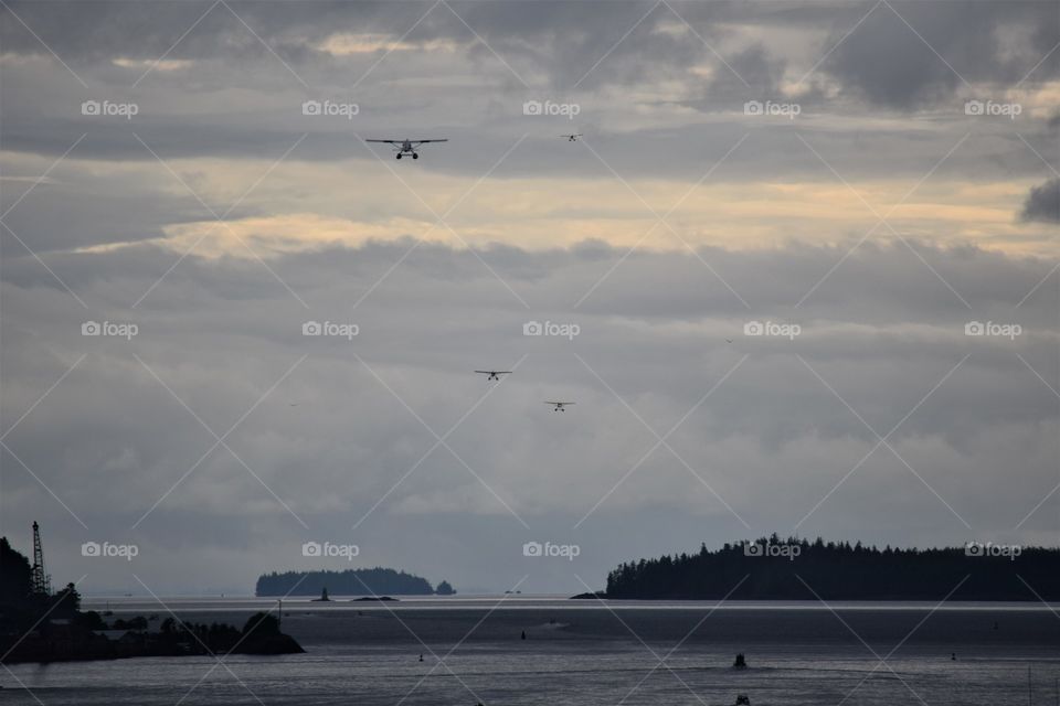 Seaplanes take off in Alaska full of sightseeing tourists