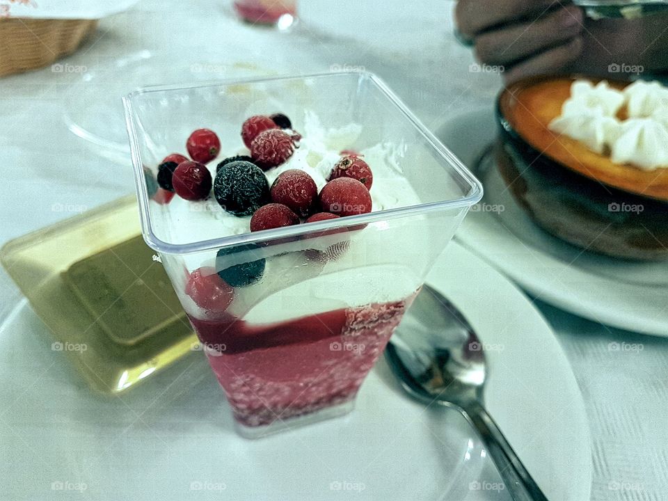Dessert cheese ice cream with raspberry sorbet and berries