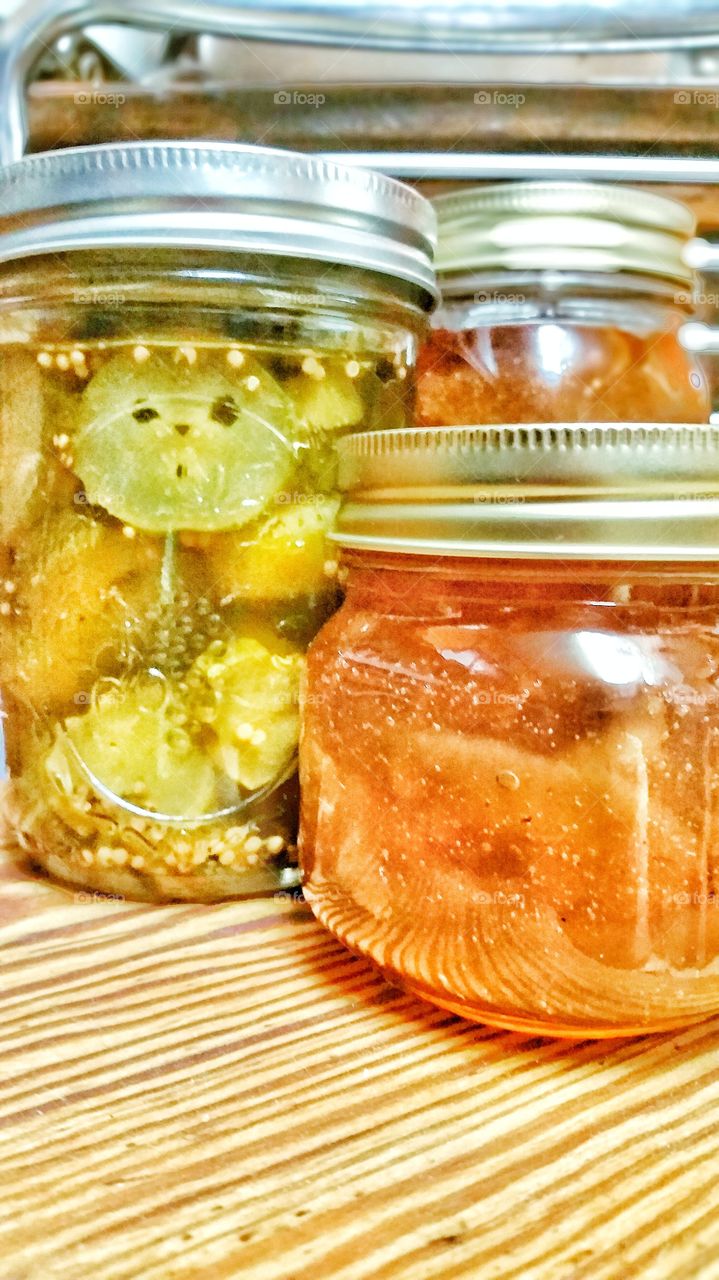 Jars of homemade pickles and jelly