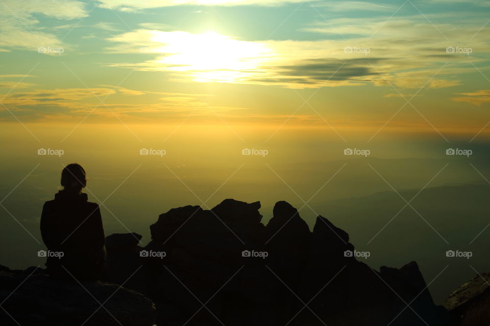 women resting at sunset in The mountains