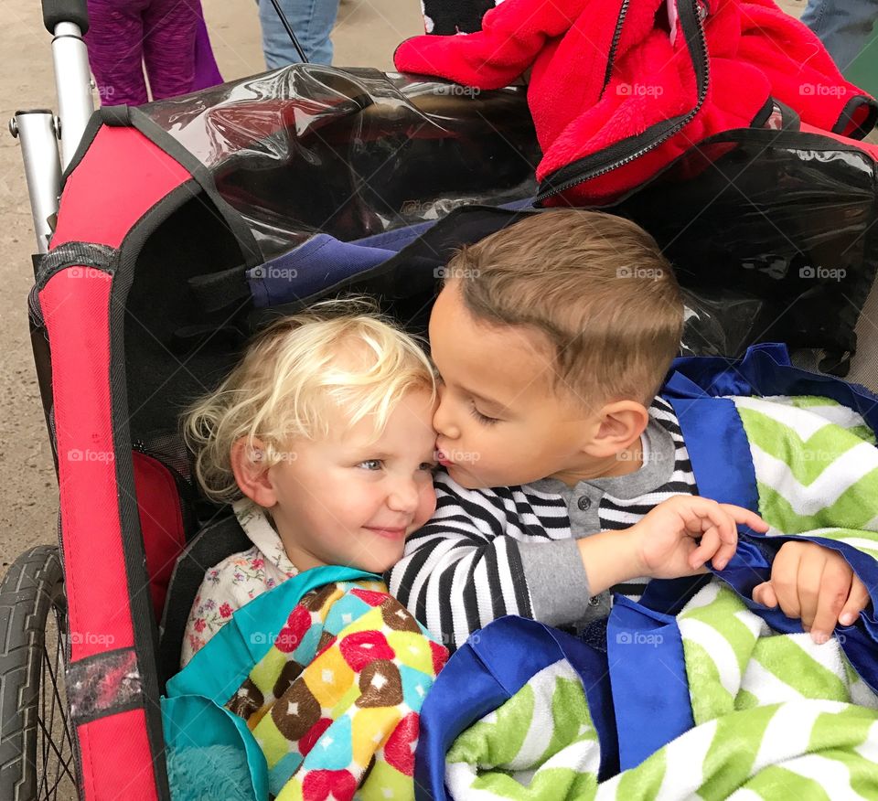Brother kissing her sister