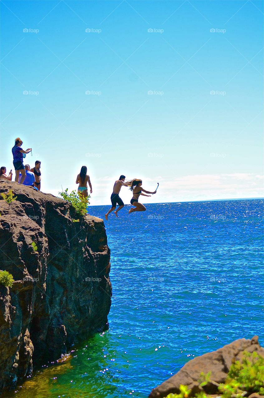 Cliff jumpers taking a selfie