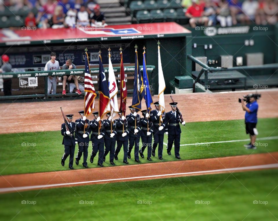 March with Pride. Military marching with flags at globe life park in Arlington on July 4th