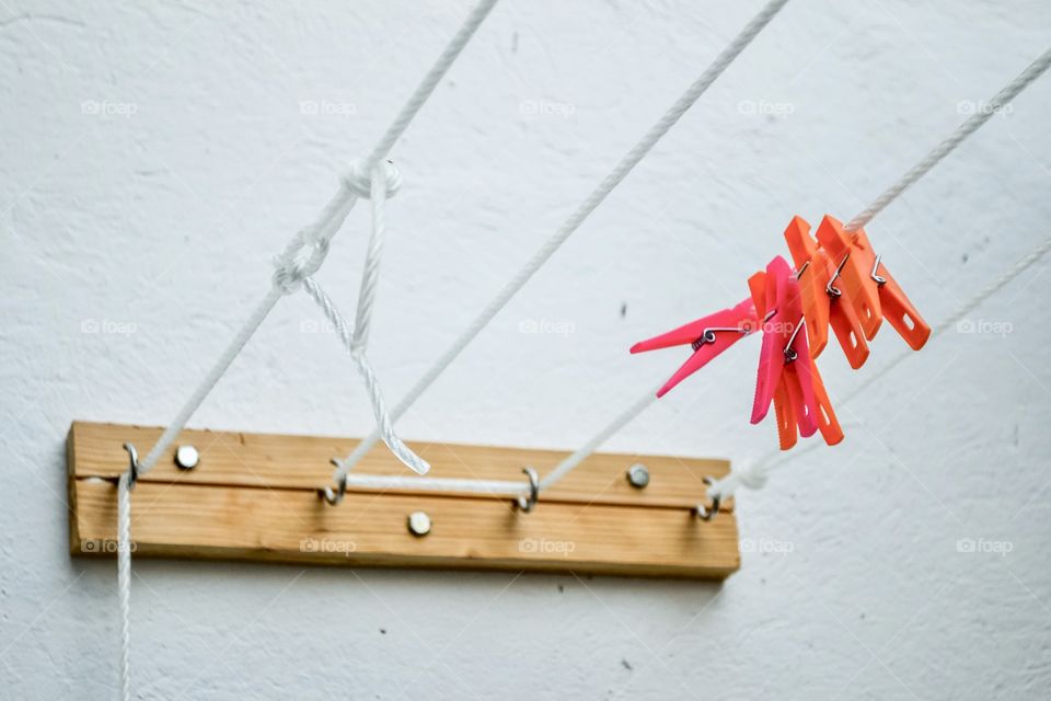 Colorful clothes nails on a clothesline