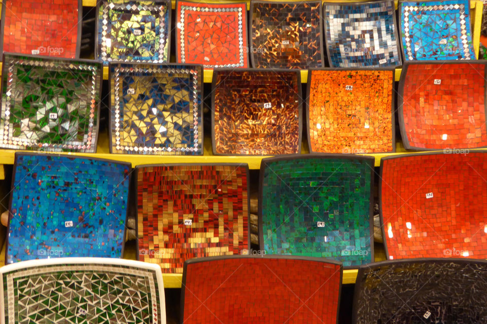 coloured quadratic plates in a shop