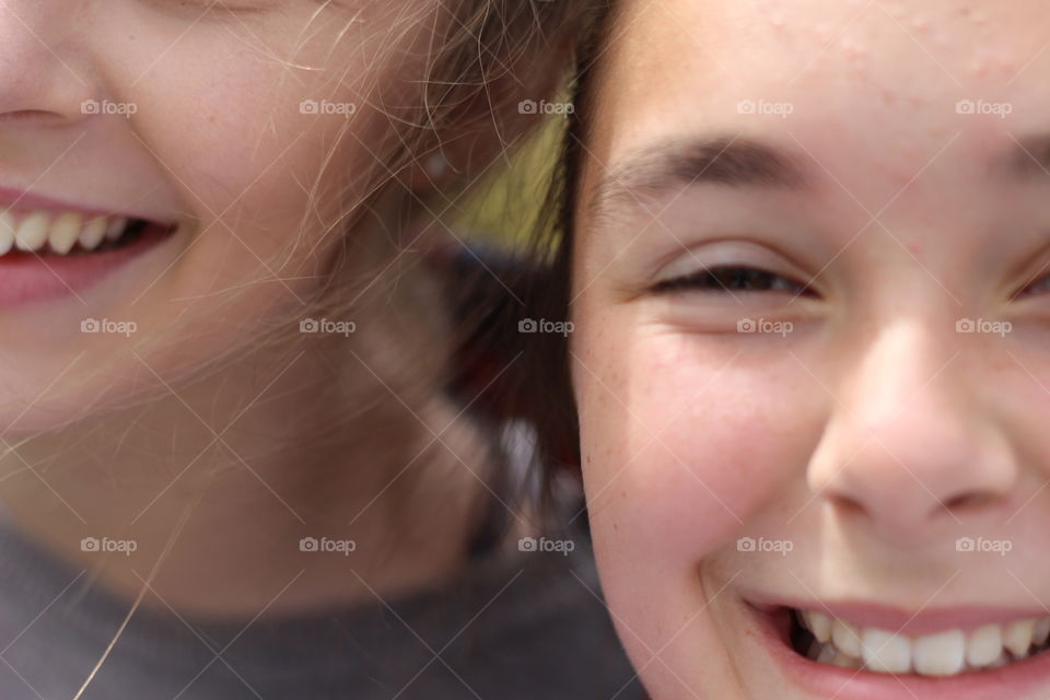 Two sister with toothy smile