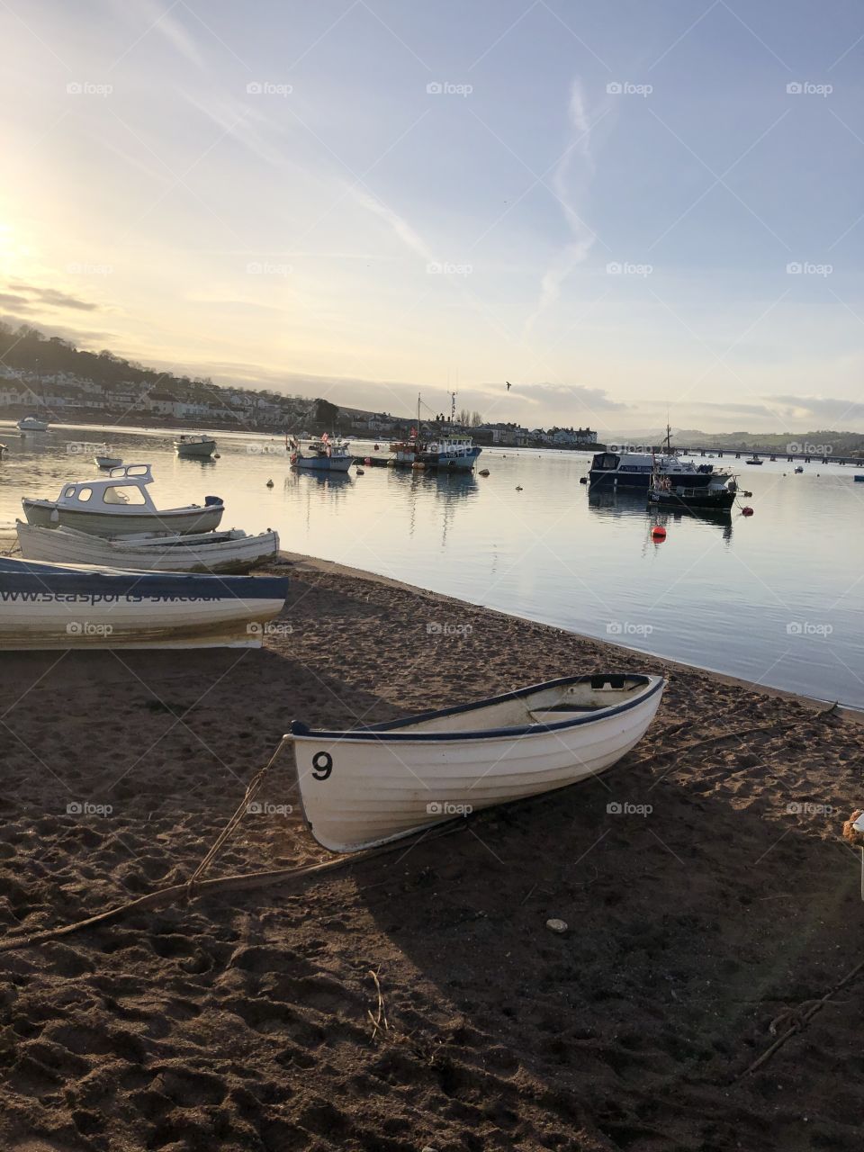 Teignmouth in Devon, UK on a late winters afternoon, with the sun beaming over the water.