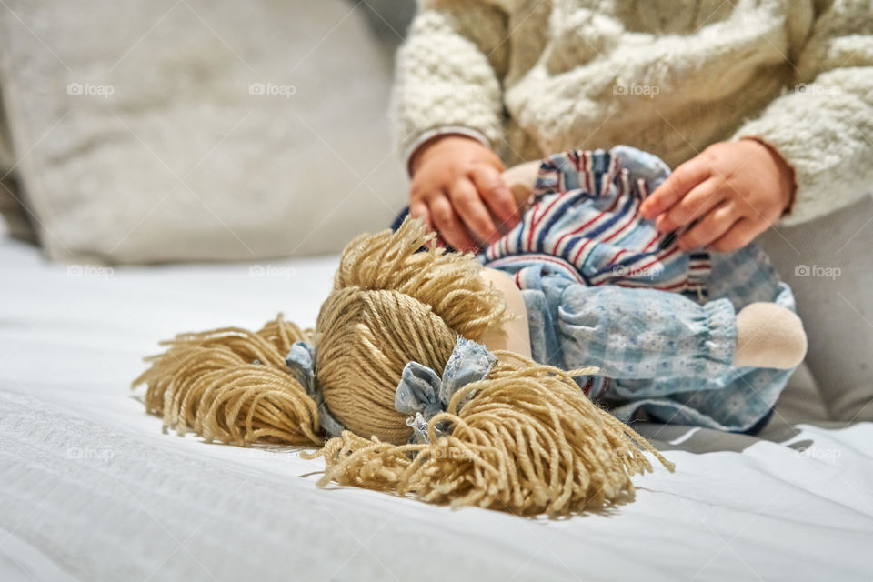 Close-up of child playing with toy