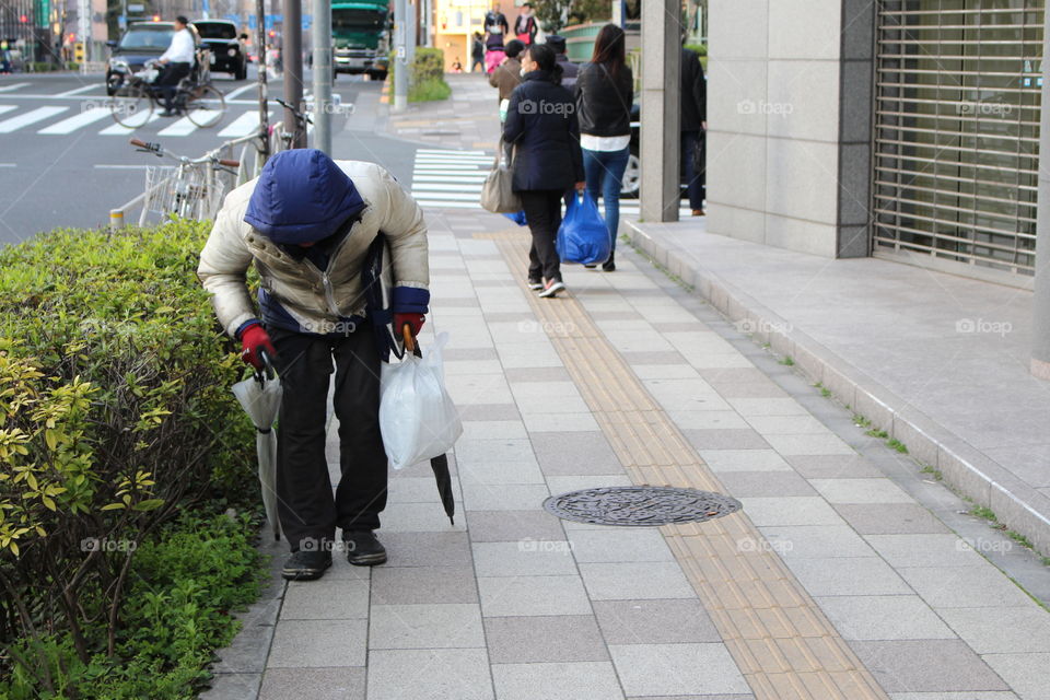 Old man walking home at Tokyo Japan 