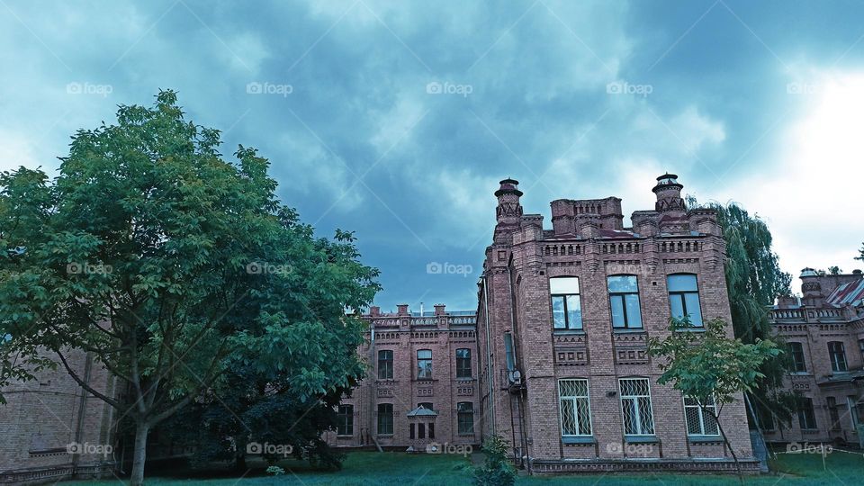 building against the backdrop of a thundercloud