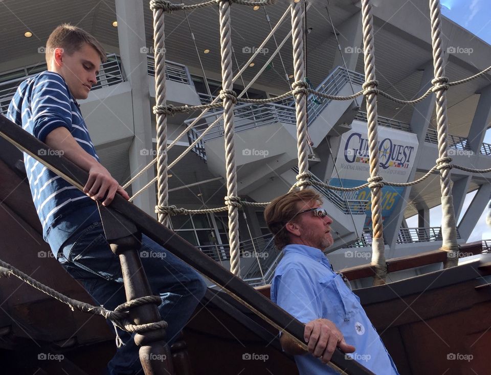 Man and a boy walking down the stairs