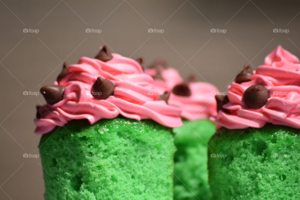 Close-up o pink and green color cupcake