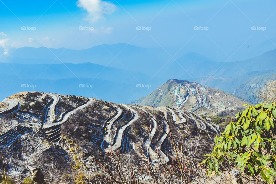 Rugged terrain of lower Himalayas in East Sikkim, Zuluk or Dzuluk, from Thambi View Point. Winding road of 32 hairpin turns. Historic Silk Route from Tibet to India. Offbeat destination in East Sikkim