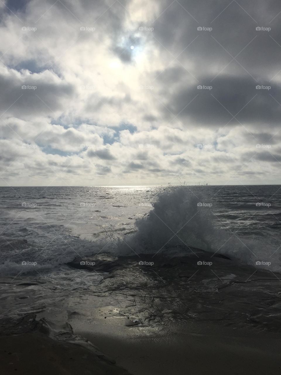 Waves and Sky with clouds and reflection 