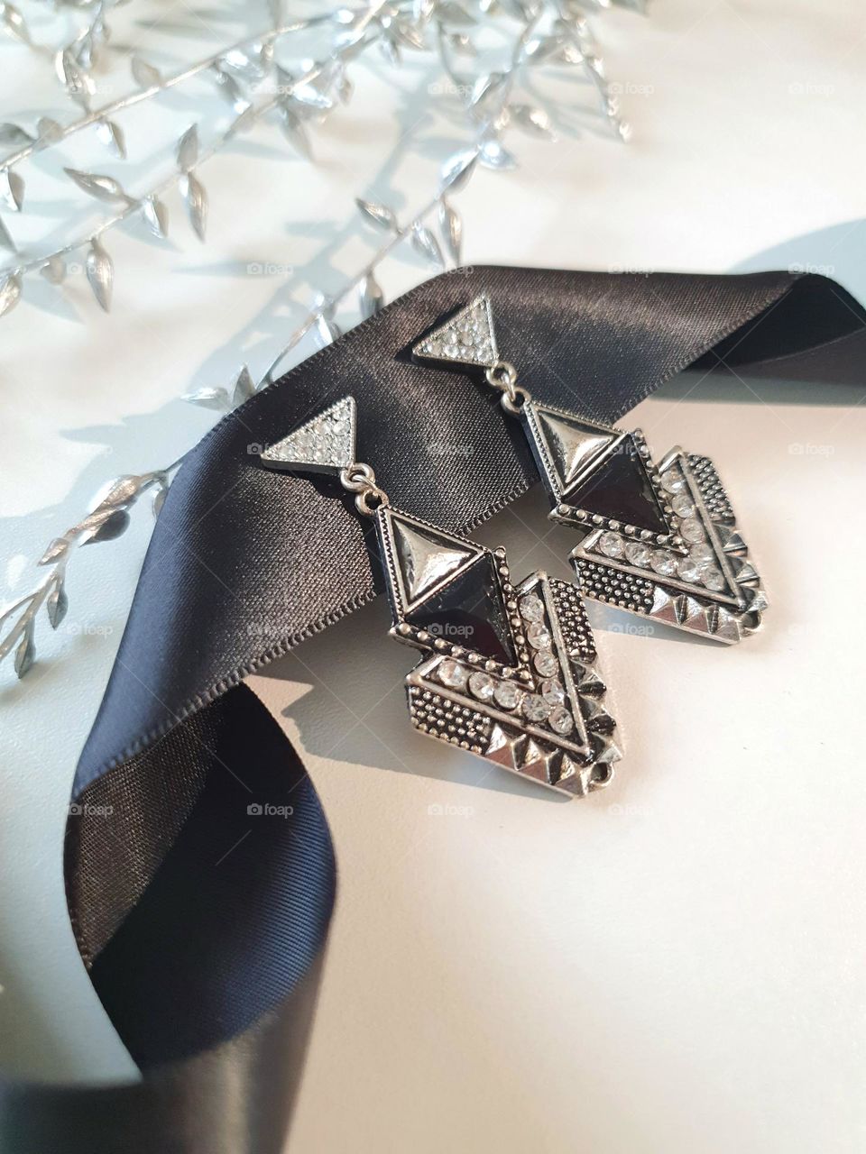 triangle - black-silver earrings with rhinestones of small triangels lie on black silk ribbon