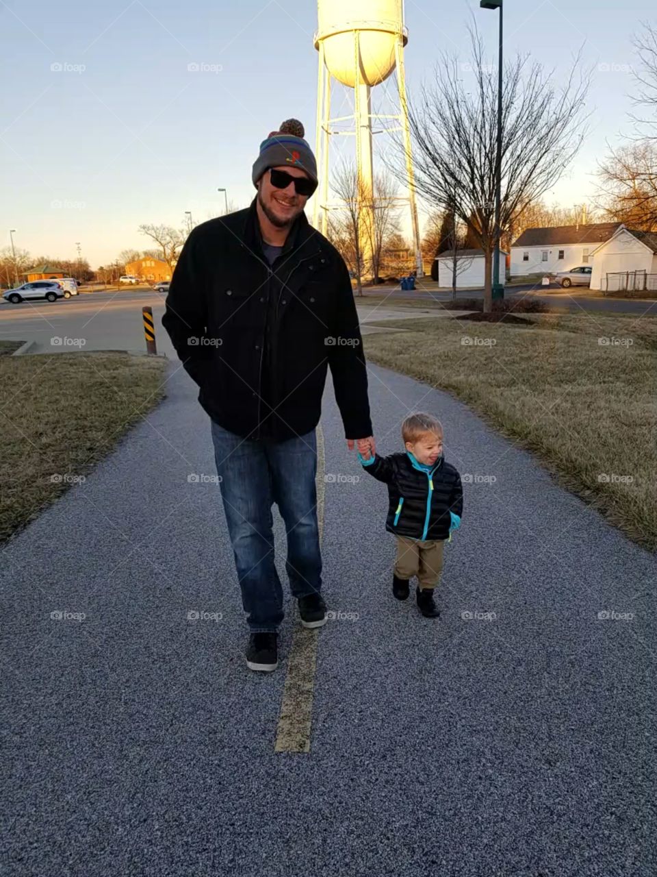 Father and son winter time walk