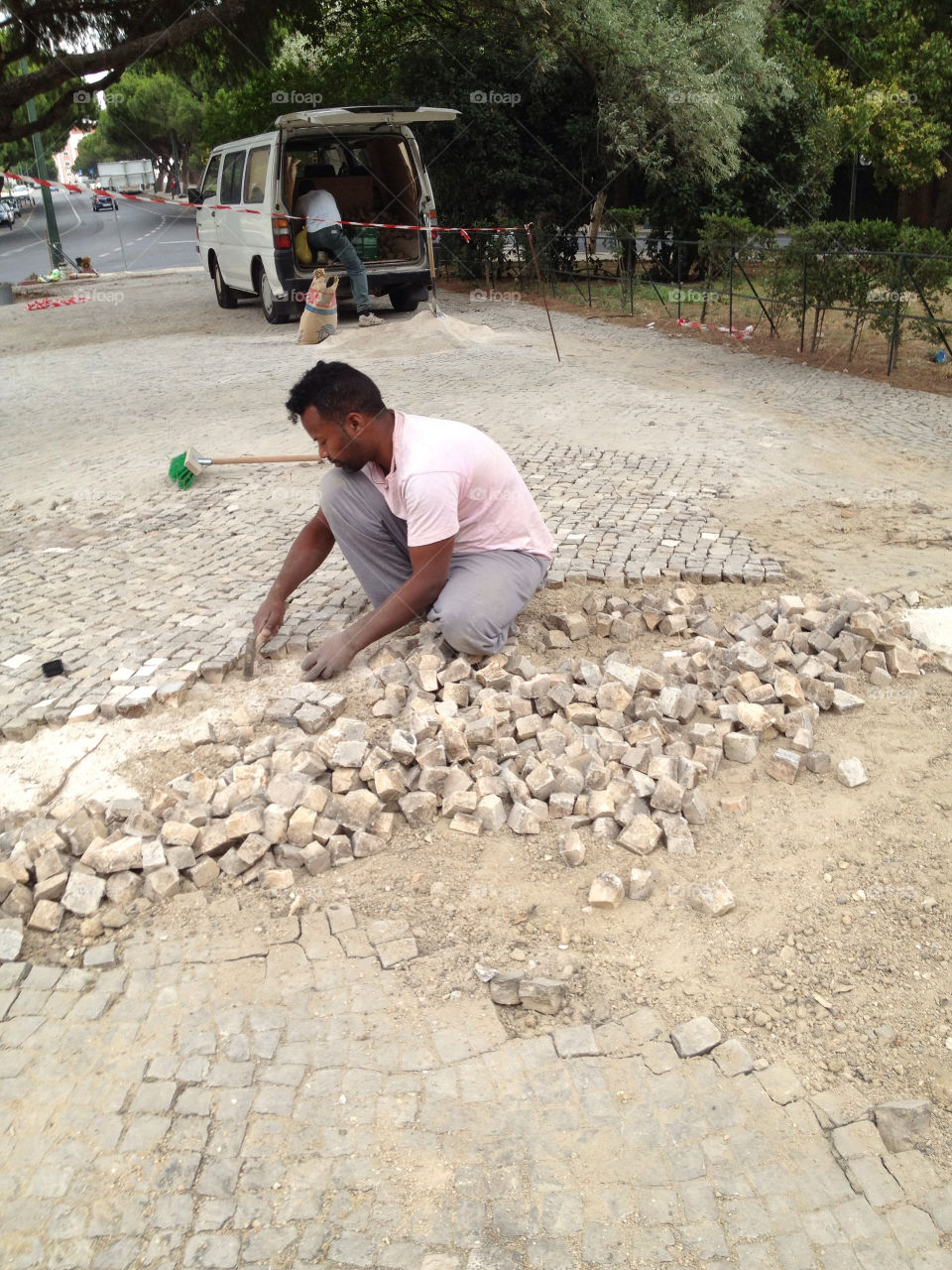 man sidewalk pavement working by boozina