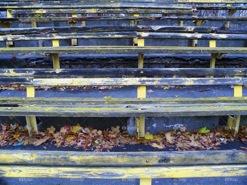 old wooden benches at the stadium, autumn