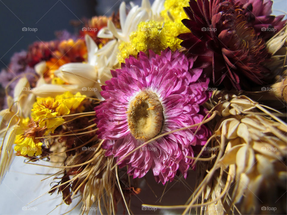 a bouquet of dried flowers and poppies on holiday