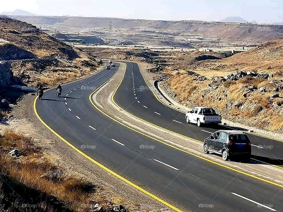 A stunning view of green mountains covered in fog in Yemen