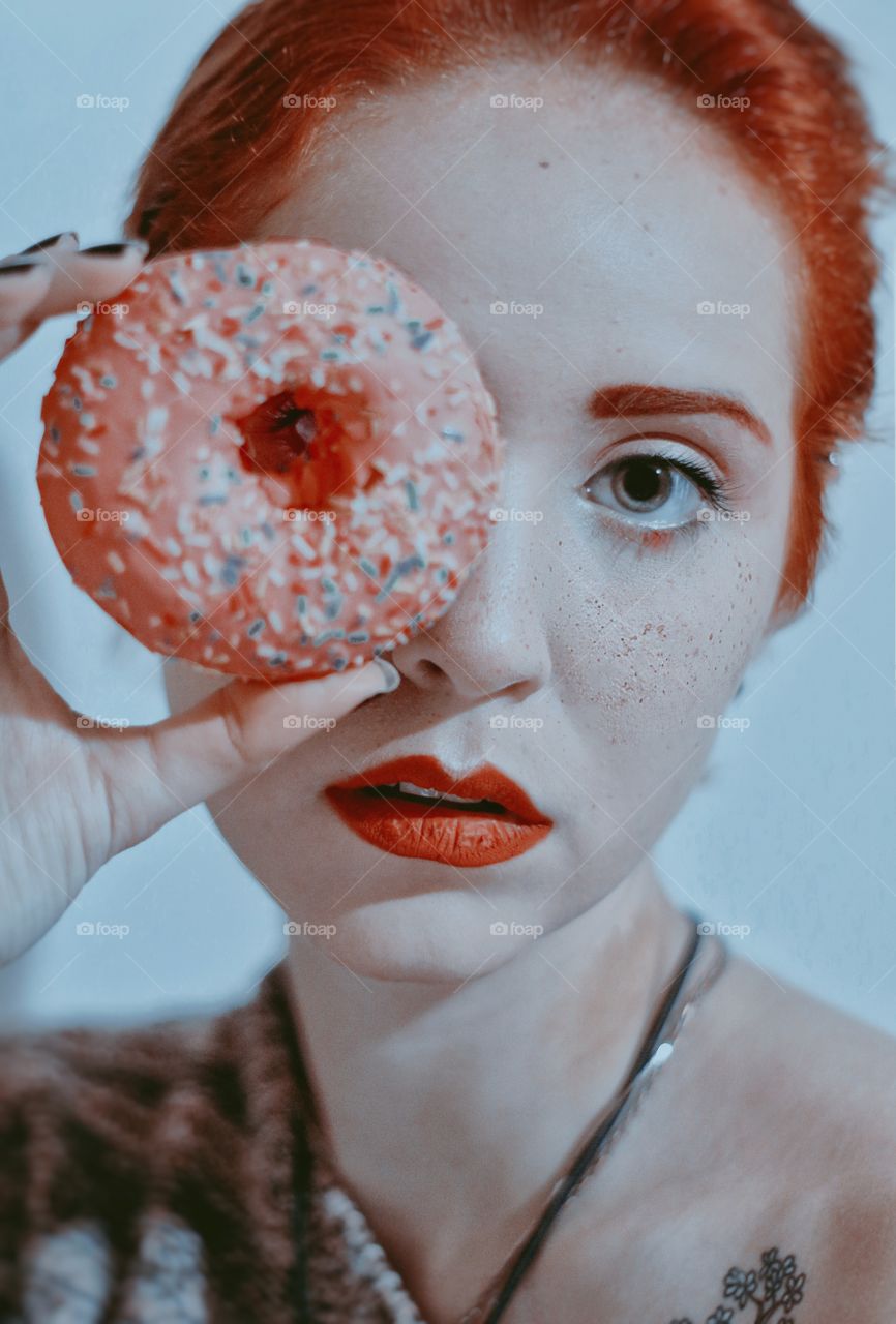Girl with a pink donut.