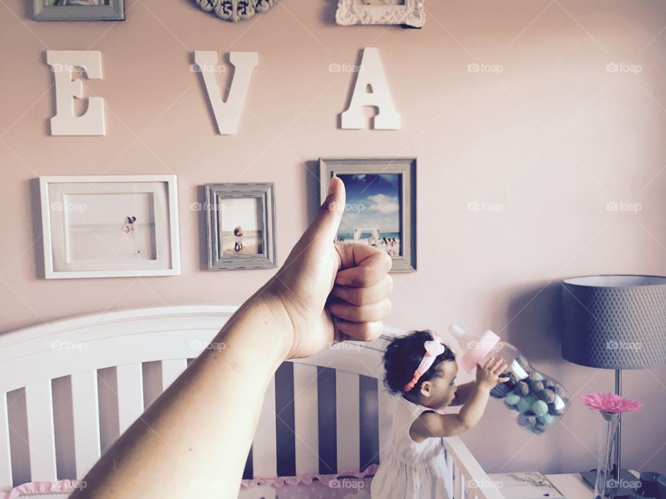Thumbs up for been the mother of a 1 year old sweet little Eva. She was actually playing with her dolls that were hidden inside her bed . When she got tired, she looked at me for a while trying to tell me something. That's when I realized she was hungry and what a better way to show me by picking up the gigantic baby bottle close to her bed . 